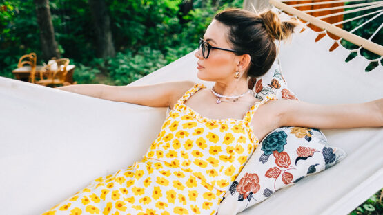 Woman relaxing in a hammock while reflecting on financial planning and divorce strategy during the summer months